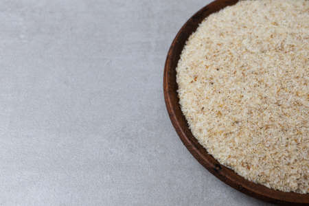 Psyllium in a clay cup on a concrete background. Food bacground. Horizontal orientationの写真素材