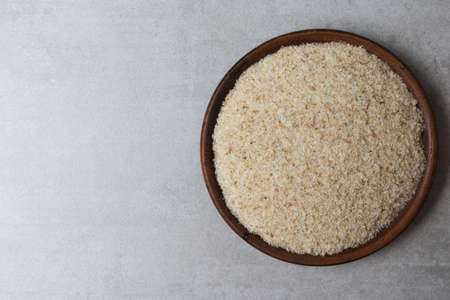 Psyllium in a clay cup on a concrete background. Food bacground. Horizontal orientationの写真素材