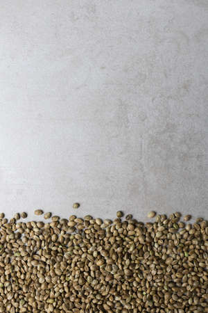 Hemp seeds on a concrete surface. Food background. Vertical orientation.の写真素材