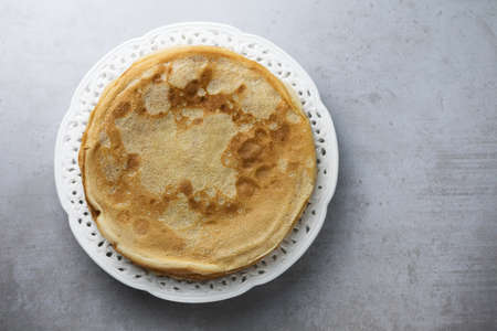 Russian pancakes on a white lace plate. Pancakes were prepared for Shrovetide.の写真素材