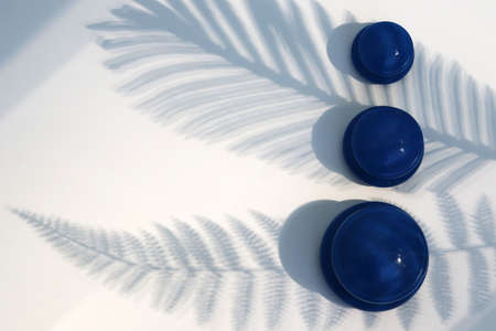 Blue vacuum massage jars on a white background.の写真素材