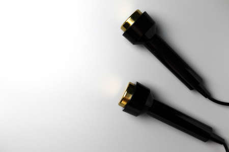 Two handpieces for ultrasonic massage lie on a gray background with space for text.の写真素材