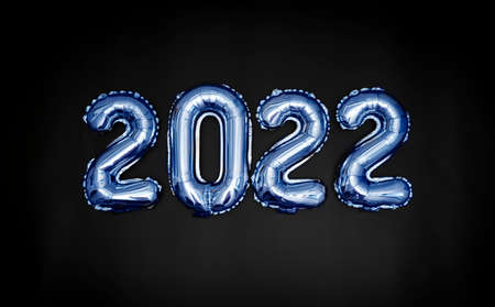 Blue balloons on a black background are laid out in the form of the number 2022. New Years banner.の写真素材
