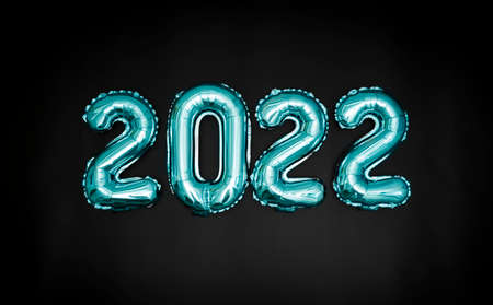 Blue balloons on a black background are laid out in the form of the number 2022. New Years banner.の写真素材