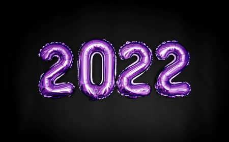 Violet balloons on a black background are laid out in the form of the number 2022. New Years banner.の写真素材
