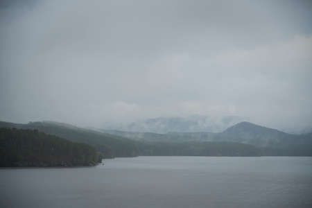 Kazakhstan, Borovoye (Kokshetau). Fog over the Auliekol lake after rain.