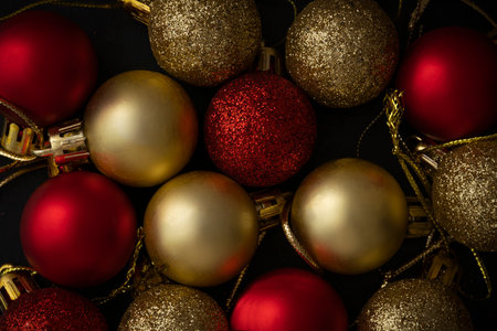 Christmas balls of red and gold color on a black background. Christmas background, screensaver. high quality photoの写真素材