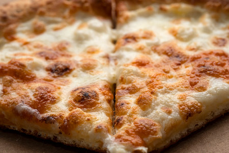 Pizza with ham in an open cardboard box.の写真素材