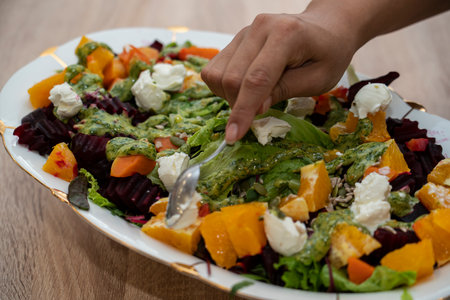Ready-made grilled beetroot, pumpkin, orange, cream cheese salad. high quality photoの写真素材
