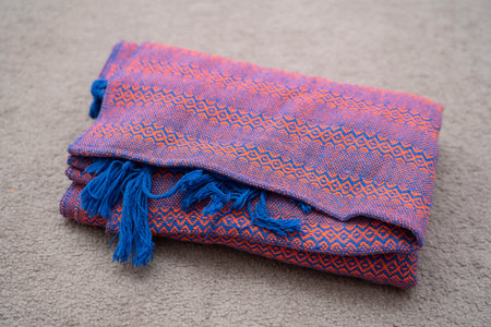The rebozo is a traditional Mexican garment worn by women. It is a wide and long hand-woven strip of wool, silk or cotton, with a long fringe on both sides. high quality photoの写真素材