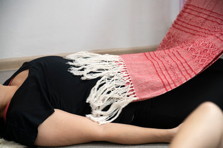 The rebozo is a traditional Mexican headscarf worn by women. Rebozo massage is done to women during pregnancy and after childbirth. high quality photoの写真素材