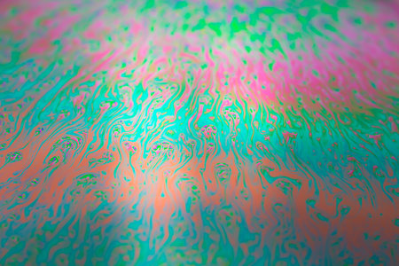 Photo of iridescent surface of soapy water. Space abstract colorful background for your screensaver. high quality photoの写真素材