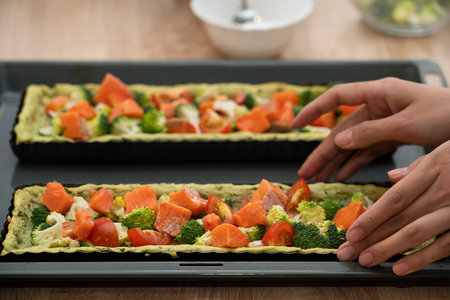 Quiche with salmon, broccoli and tomatoes before baking. Cooking a pie. high quality photoの写真素材