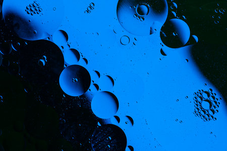 Blue abstract, texture background of oil bubbles on water. Space background for screen saver, cover,...