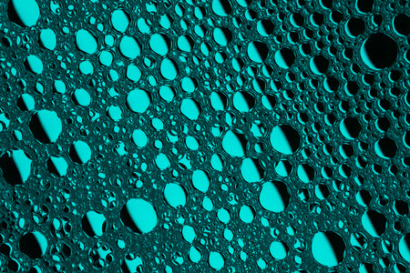 Blue abstract, texture background of soap bubbles on water. Background for screen saver, cover, wallpaper. high quality photoの写真素材