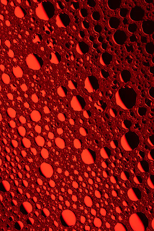 Red abstract, texture background of soap bubbles on water. Background for screen saver, cover, wallpaper. high quality photoの写真素材