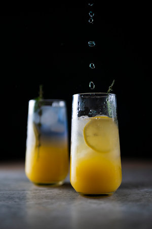 Bright refreshing cocktail. Pink lemonade with blue ice cubes. Galaxy lemonade. high quality photoの写真素材