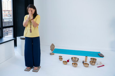 A young Asian woman stands on boards with nails (Sadhu). Nail session. high quality photo