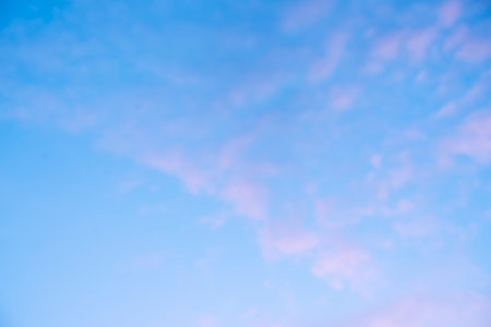 Pink clouds in the sunset sky. Gradient natural background with place for text. high quality photoの写真素材