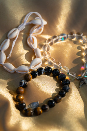 Handmade bracelets made from natural stones and shells. High quality photo