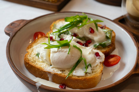 Brioche with poached egg for breakfast. High quality photoの写真素材