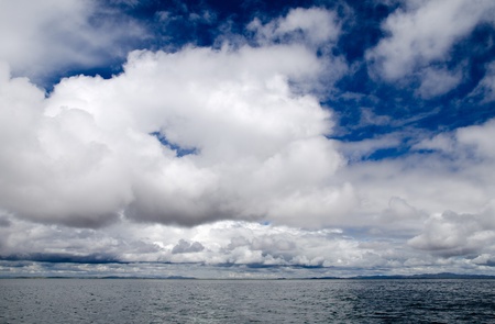 Spectacular cloudscape over a choppy Lake Titicaca, Peruの写真素材
