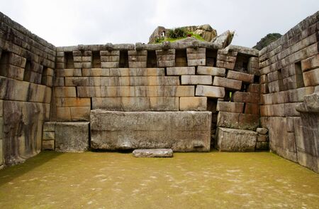 The three-sided Main Temple at Machu Picchu shows some damage in the right back corner caused by the settling ground  Machu Picchu, Peruの写真素材