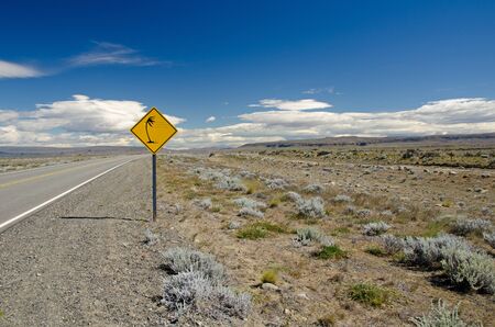 Traffic sign warning of gusty winds on route   40 near Lago Argentino in Patagonia, Argentinaの写真素材