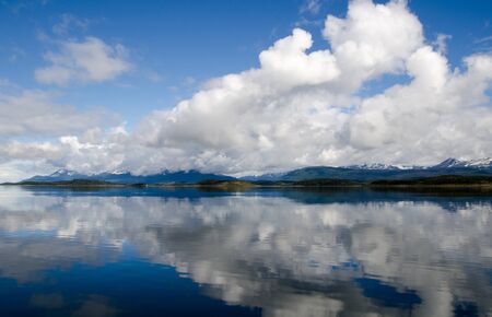 Dramatic sky and reflection on the Beagle Channel, Patagonia, Argentinaの写真素材
