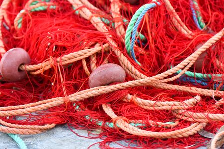 Fishing nets with red, green, orange colors.の写真素材