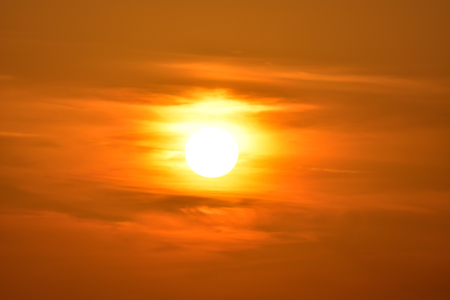 The sun between clouds Sunset with clouds.の写真素材