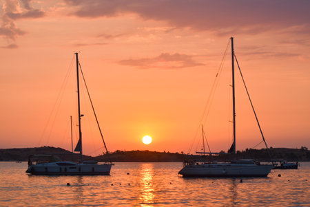 Sailing boats on the sea at sunset.の写真素材