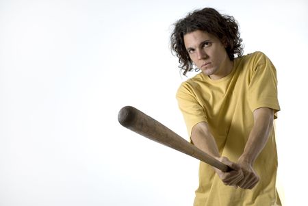 Man holding a baseball bat wearing a very serious expression on his face. Horizontally framed...