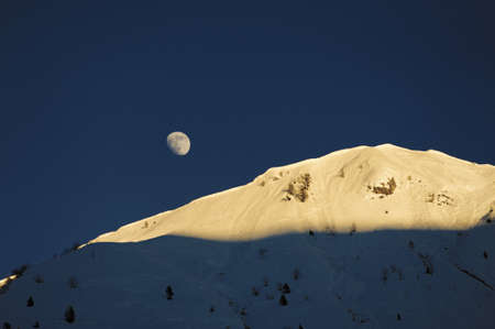 Panorama Mountain - snow-covered peak at dawnの写真素材