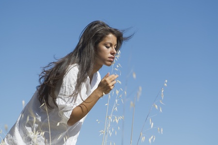Young woman freely through the meadows の写真素材