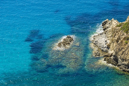 Panorama seen from the sea, clear water and rocks-stone  Mediterranean Sea, Sardinia, Italy 