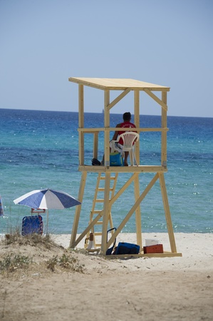 A lifeguard control tower overlooking the sea from the beach in Sardinia のeditorial素材