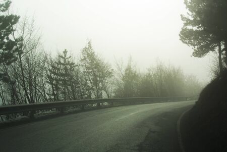 Mountain road on a foggy day