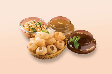 Fried and Spicy Aero Plane Snacks or Fryums (Snacks Pellets) served in a bowl or White background....
