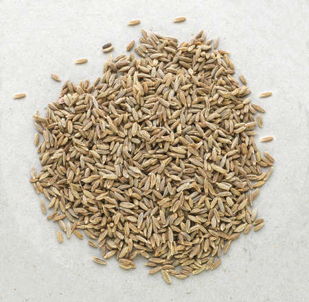 cumin seed of background photographics, Pile of cumin seeds isolated on white background, top view