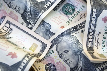 Close up of 10 dollar notes.