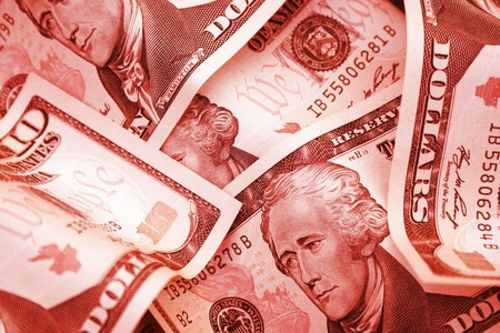 Red dollars, symbolizing debt.  It could be through a loan, a mortgage, or just simply owing money to people or banks.  Debt is usually bad, especially at the individual level but also for companies.  In the current economic climate, everyone is facing a の写真素材