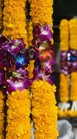 Flowers used for religious purposes hanging in Bangkok's flower market. の写真素材