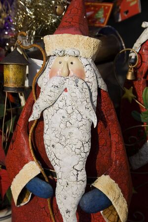 This is a model of a traditional looking Santa Claus.  He has a long beard and a red uniform.の写真素材