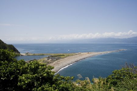 A sea spit of the coast of turtle island, Taiwan. This is one is called the turtle tail because of the  curl at the end of it.の写真素材