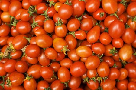 Fresh Tomatoes, the healthy choice.  These cherry tomatoes are on display in a market.  Tomatoes are a healthy and natural food.の写真素材
