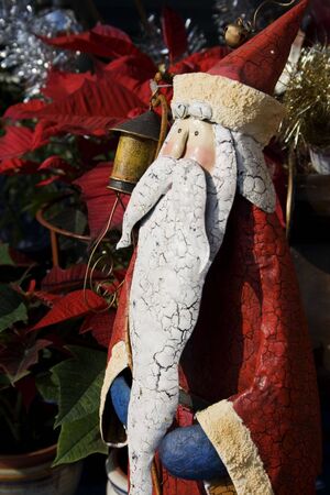 This is a model of a traditional looking Santa Claus.  He has a long beard and a red uniform.の写真素材