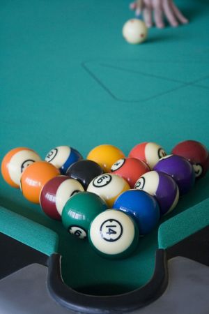 Playing pool with all the balls over the pocket.  This sport requires a lot of thinking to play well. の写真素材