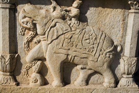 A carving in stone of elephants, cows and horses.  This was taken at an Indian palace and probably depicts the role of animals in royal India.の写真素材