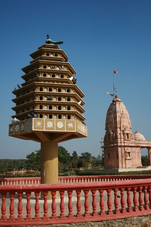 Bird House and Indian temple in the background. The bird house is for pigeons. の写真素材